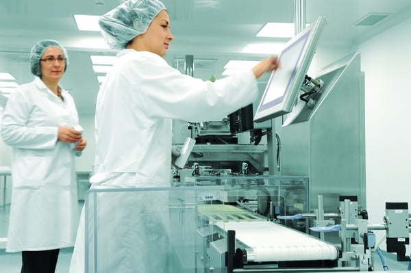 Working people at  production line in modern factory