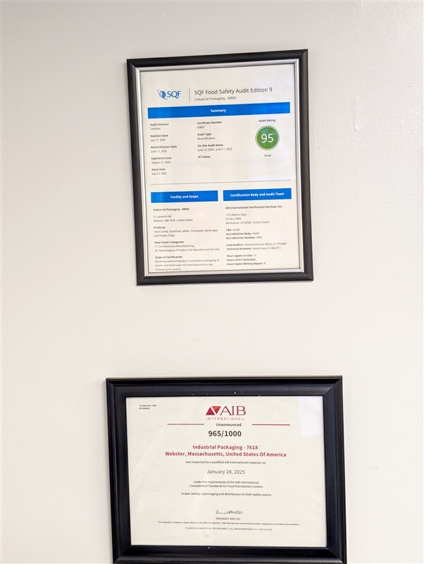 SQF and food safety certification documentation displayed at contract packaging facility quality management station