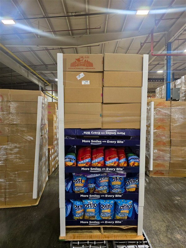 Club store pallet display of snack multipacks built to 48x40 inch footprint for Costco compliance