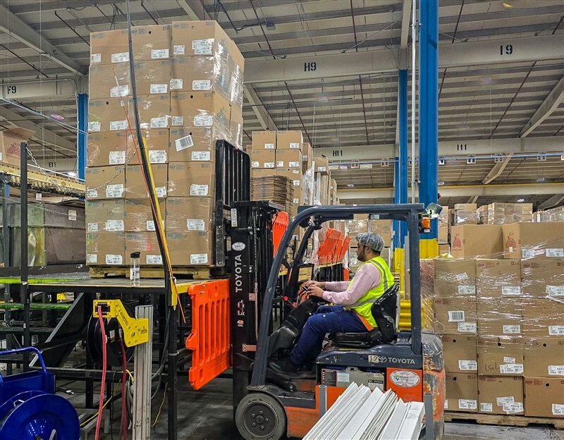 Finished pallets staged in warehouse ready for shipment, showing proper pallet configuration and height